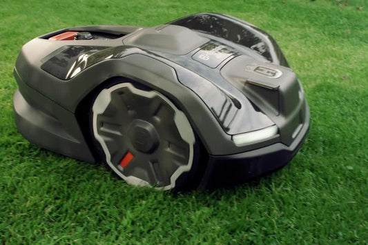 Husqvarna Automower EdgeCut feature beside a lawn edge