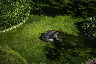 Husqvarna Automower 308V mowing in a garden